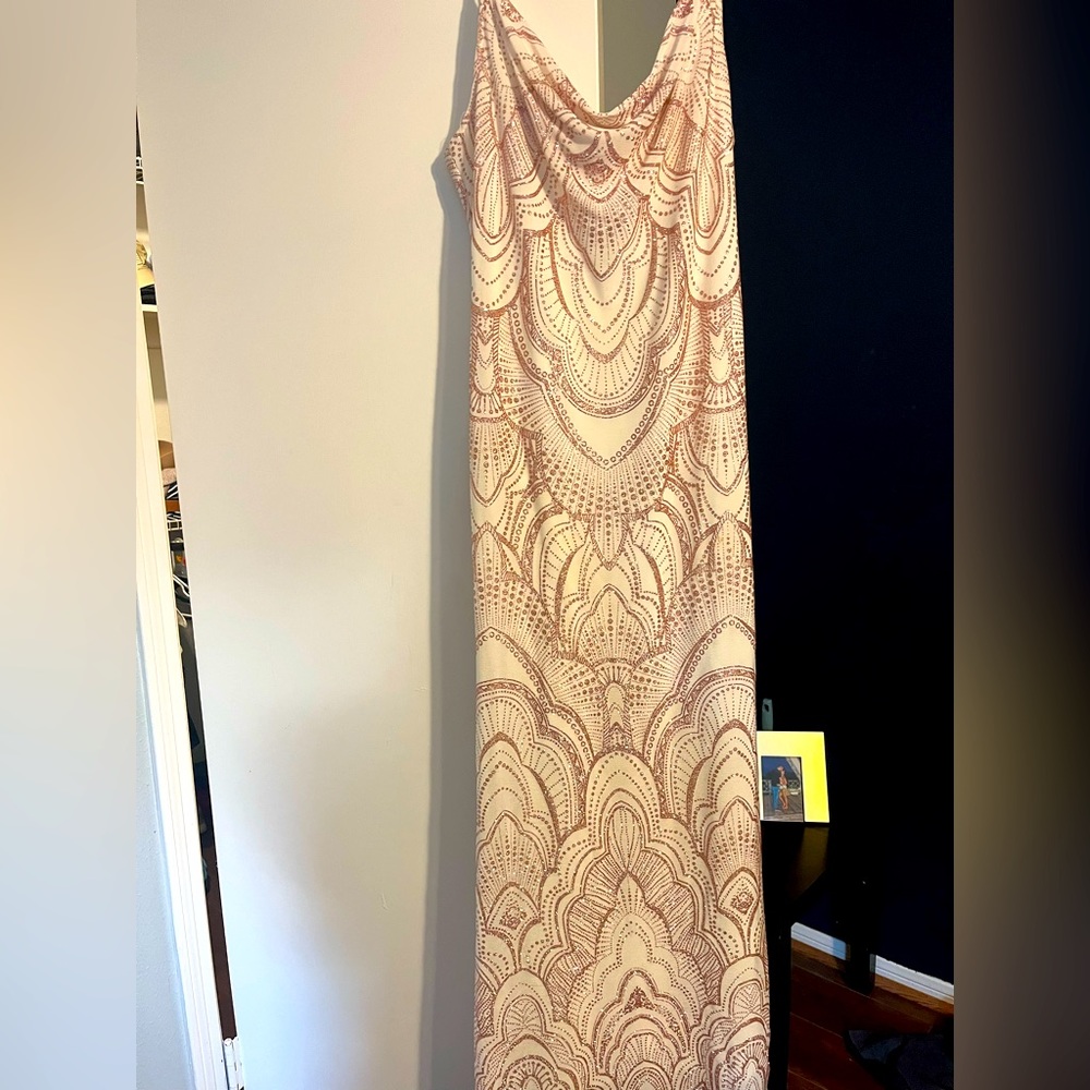 White dress with pink glittered detail.